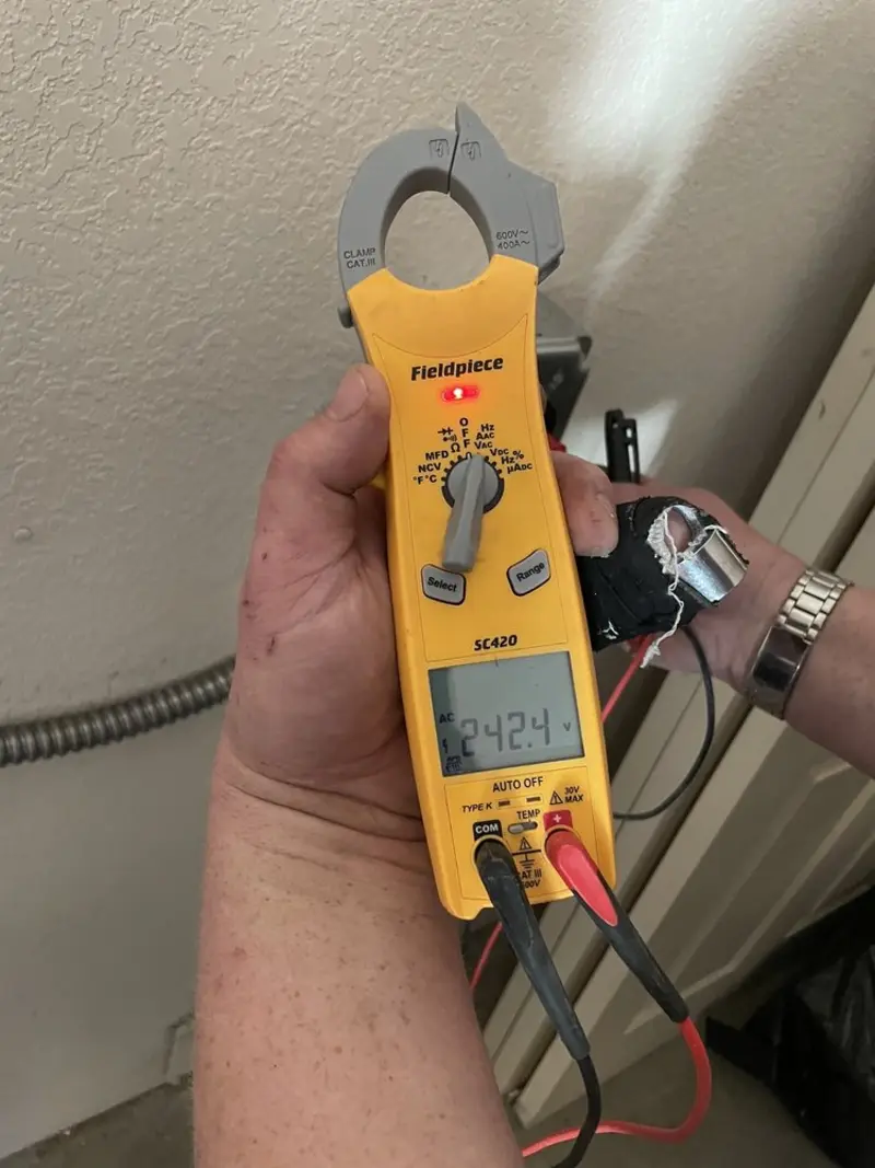 Voltage testing with clamp meter during Circuit Breaker Repair in Littlefield